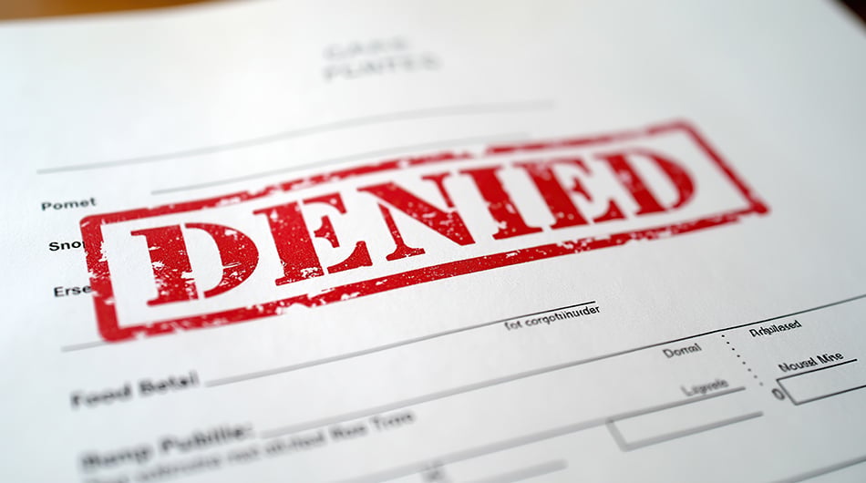 Form with a stamp on it that says denied
