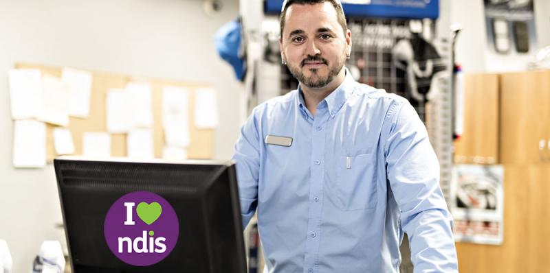 service provider standing behind his computer