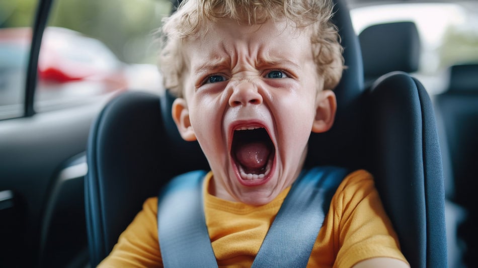 Child screaming with a seat belt on in the car