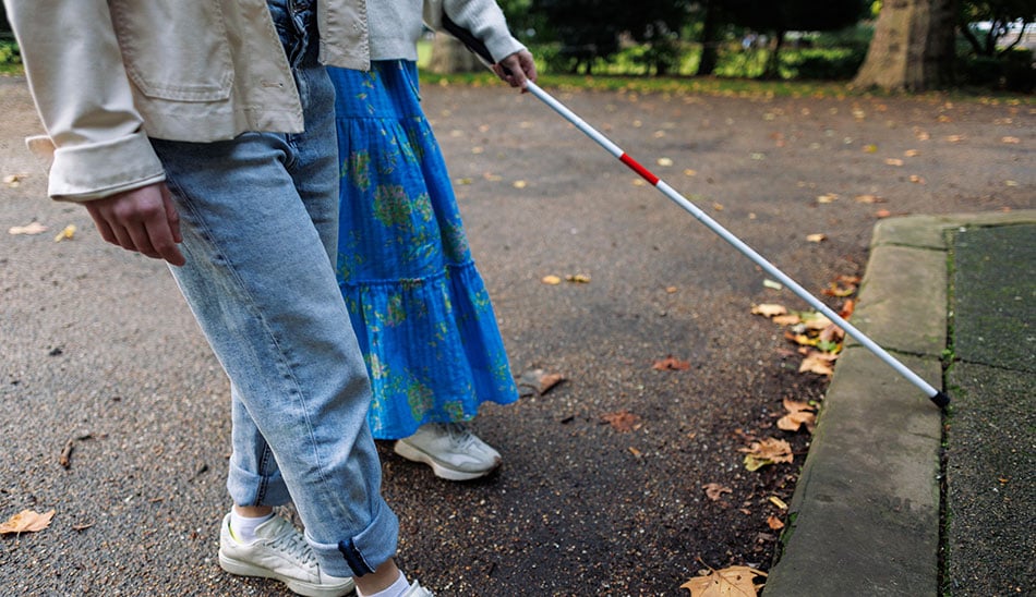 Support worker with a person with impaired vision