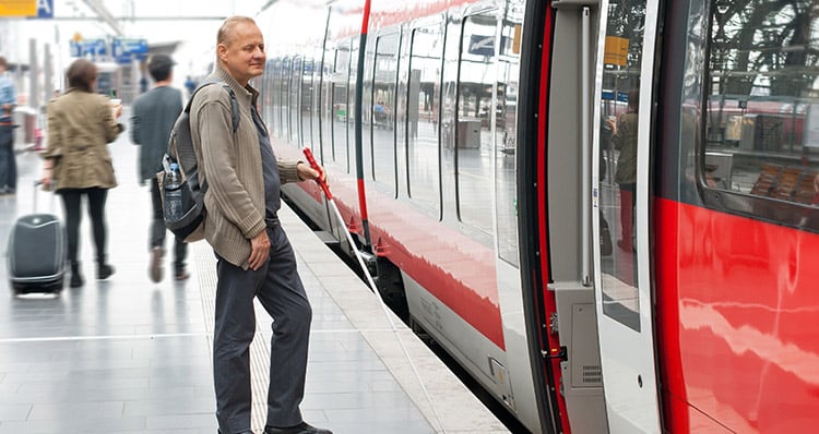 Blind man waiting for a train