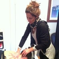Moira working on a patient