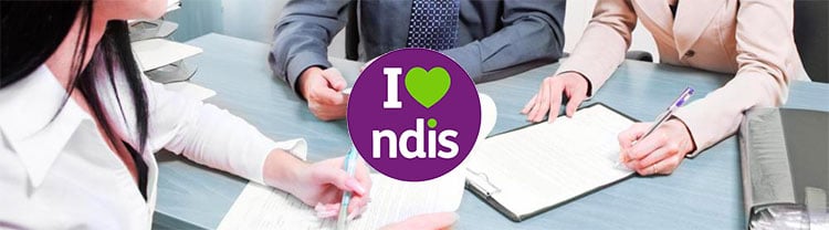 Participant signing an NDIS service agreement