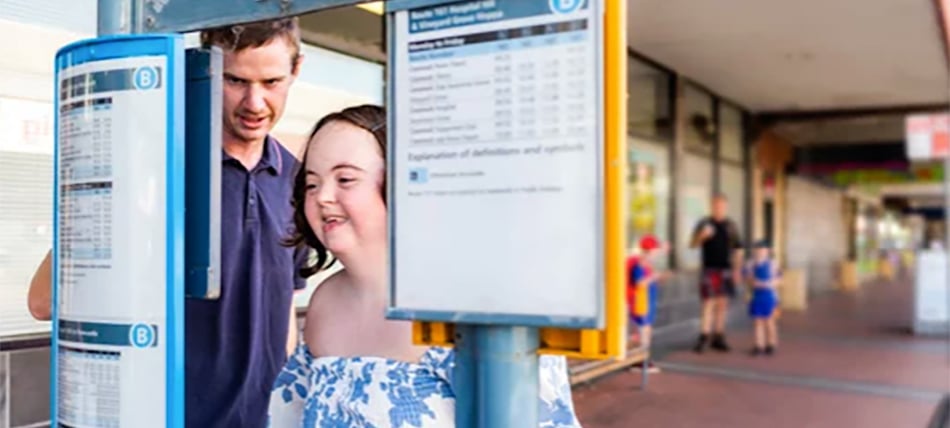 Support worker with a participant learning to catch the bus